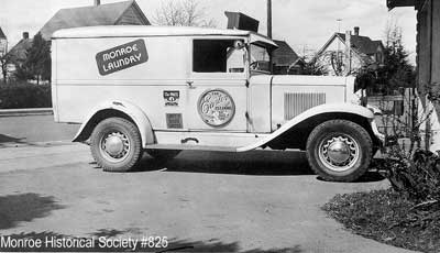 A black-and-white archival photograph of early Monroe from the Monroe Historical Society